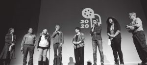 ReFrame 2020 Community Partners introducing a film on-stage at Showplace