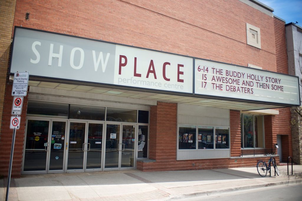 The front entrance to Showplace Performance Centre, showing a bank of double doors beneath a marquee sign.