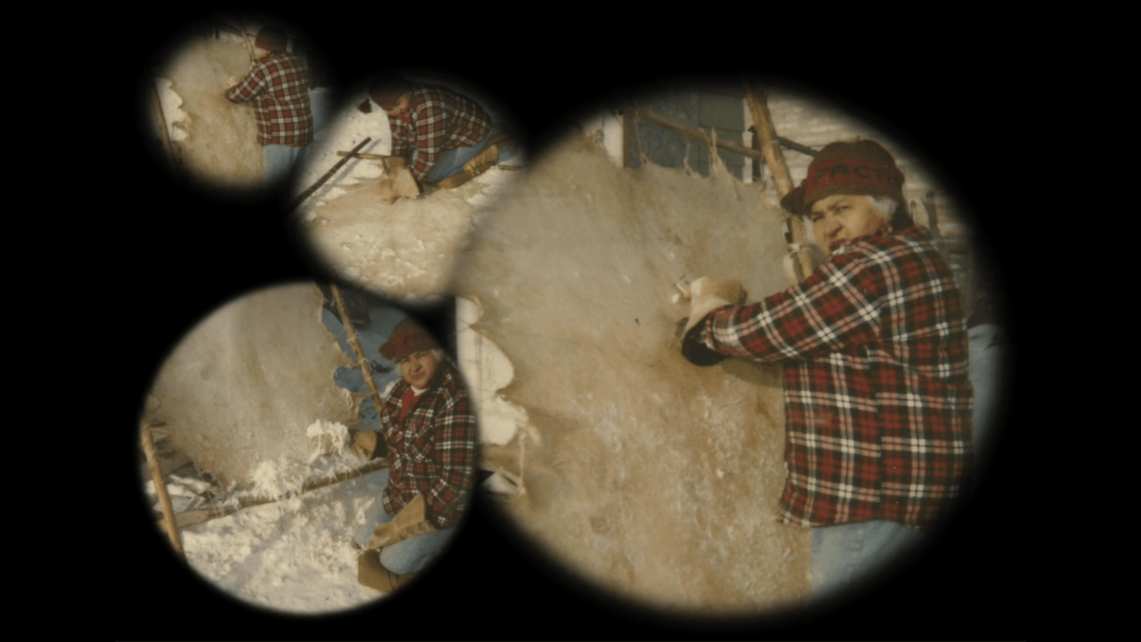 Viewed through multiple circular vignettes, the image captures an individual engaged in the process of hide tanning. The person is wearing a red plaid jacket and a warm cap, indicating a cold environment with snow on the ground. They are using tools to scrape and work on the hide, which is stretched out on a frame. Each circular frame overlaps to create a collage effect, showcasing different stages or angles of the hide tanning process.