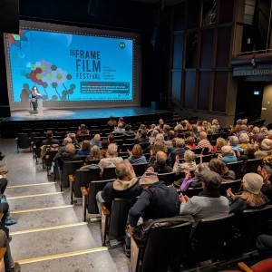 Audience at Showplace listening to opening night presenter.