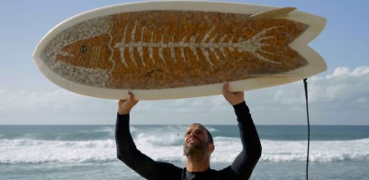 Film Still 48 - Jack Johnson with a Ciggy Board in Hawaiʻi.jpg